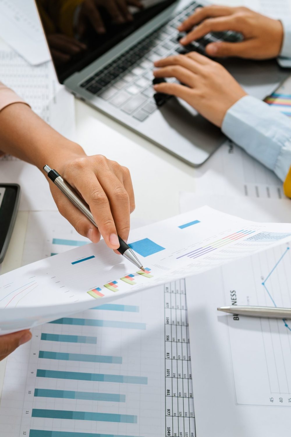 accountant pointing on laptop for meeting team in office room. accountant pointing on laptop for meeting team in office room. concept finance and accounting